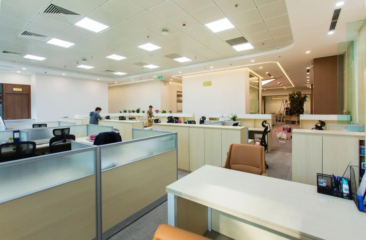 Modern open-plan office with rows of workstations